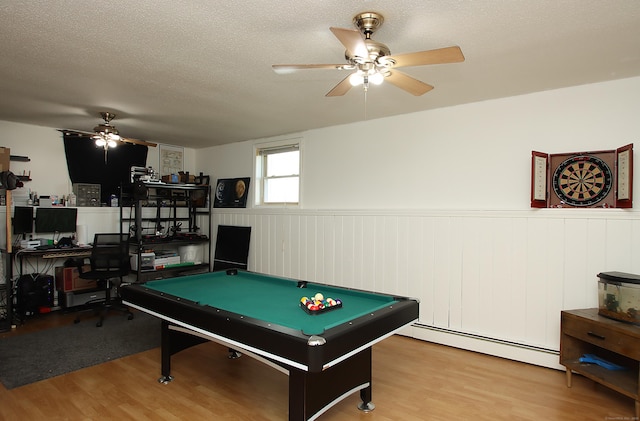 537 Hobart St, Southington, CT 06489 - playroom with a ceiling fan, wood finished floors, a baseboard heating unit, a wainscoted wall, and a textured ceiling