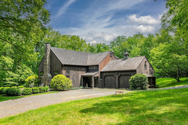 88 Hemlock Rd, Roxbury, CT 06783 - rustic home featuring a chimney, a garage, a front lawn, and driveway