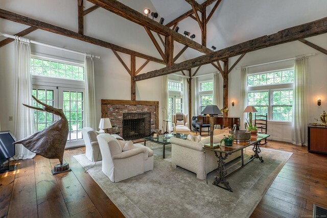 88 Hemlock Rd, Roxbury, CT 06783 - living area featuring high vaulted ceiling, hardwood / wood-style flooring, a fireplace, beam ceiling, and baseboards