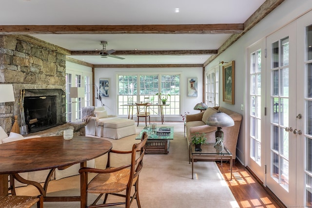 88 Hemlock Rd, Roxbury, CT 06783 - living area featuring french doors, a ceiling fan, beamed ceiling, and a fireplace