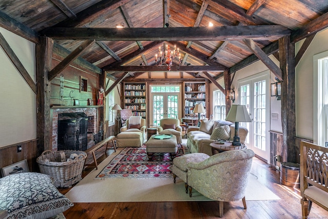 88 Hemlock Rd, Roxbury, CT 06783 - living room with hardwood / wood-style flooring, french doors, a fireplace, built in shelves, and wood ceiling