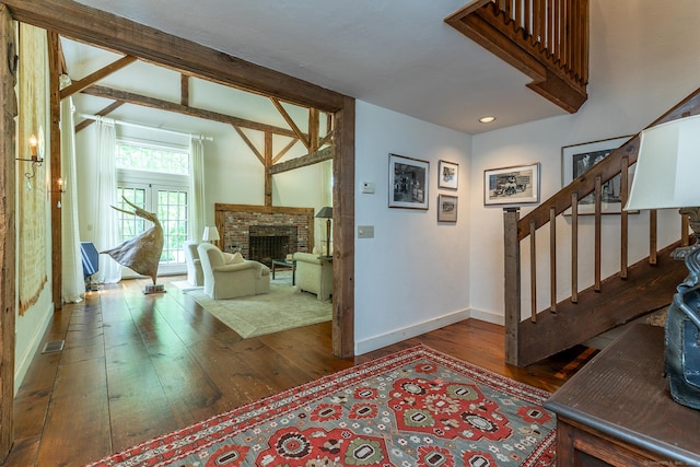 88 Hemlock Rd, Roxbury, CT 06783 - entrance foyer featuring wood-type flooring, baseboards, stairway, and a fireplace