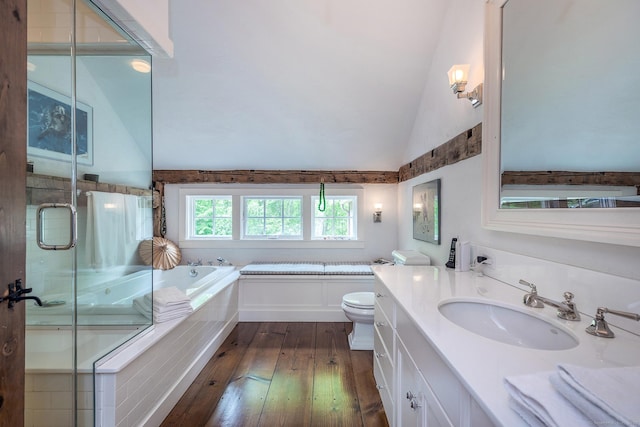 88 Hemlock Rd, Roxbury, CT 06783 - bathroom with hardwood / wood-style flooring, a bath, lofted ceiling, vanity, and toilet