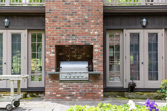 88 Hemlock Rd, Roxbury, CT 06783 - entrance to property with french doors, brick siding, and area for grilling