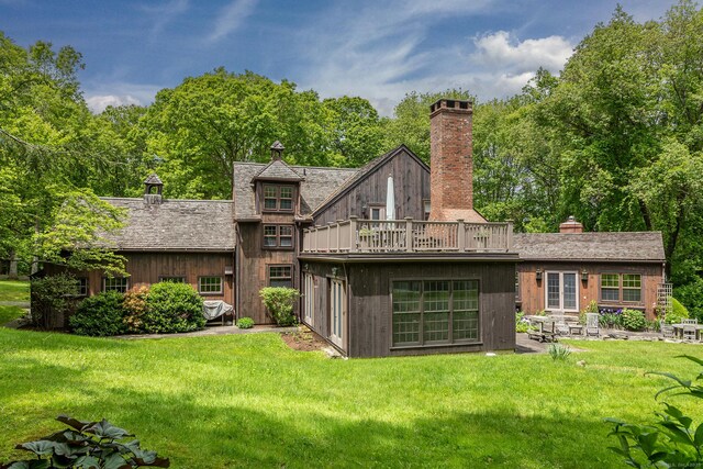 88 Hemlock Rd, Roxbury, CT 06783 - back of house with a chimney, a yard, and french doors
