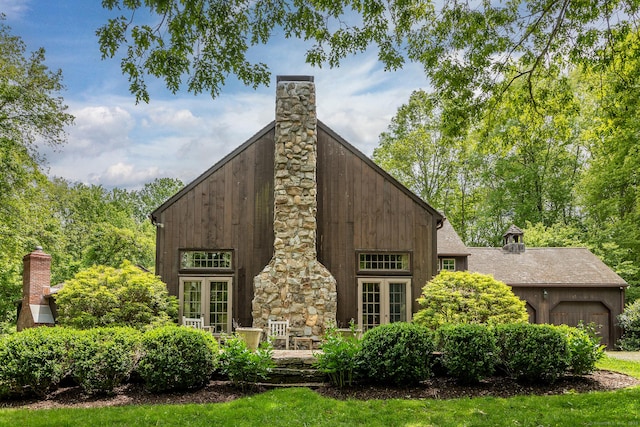 88 Hemlock Rd, Roxbury, CT 06783 - rear view of property featuring a chimney and french doors
