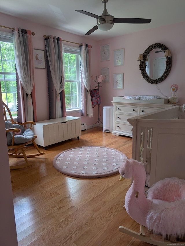 35 Snake Meadow Rd, Killingly, CT 06239 - bedroom featuring light wood-type flooring, baseboard heating, and a ceiling fan