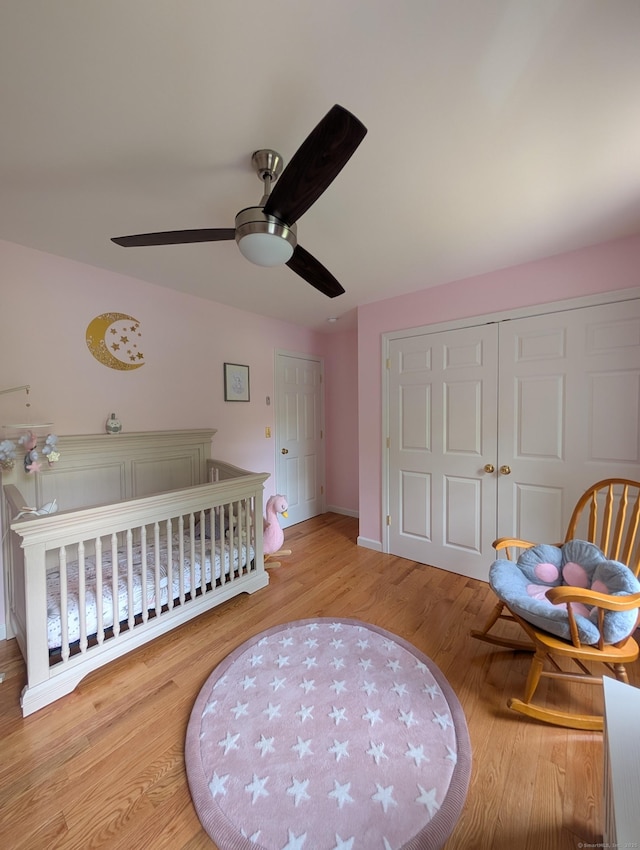 35 Snake Meadow Rd, Killingly, CT 06239 - bedroom with wood finished floors, a nursery area, baseboards, ceiling fan, and a closet