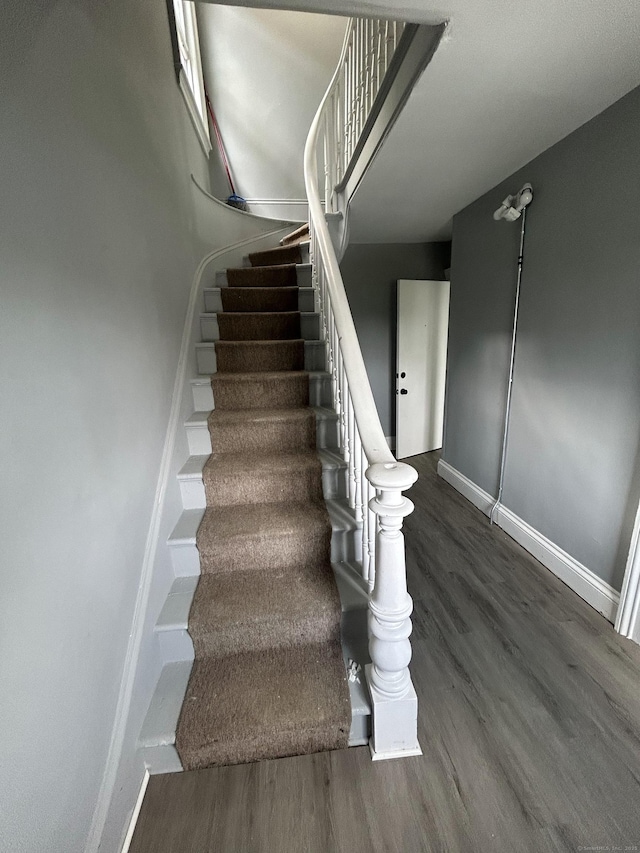 51 Division St, Norwich, CT 06360 - stairway featuring wood finished floors