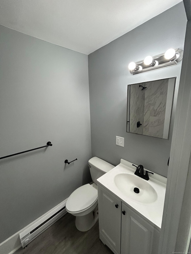 51 Division St, Norwich, CT 06360 - bathroom with a baseboard radiator, wood finished floors, and vanity