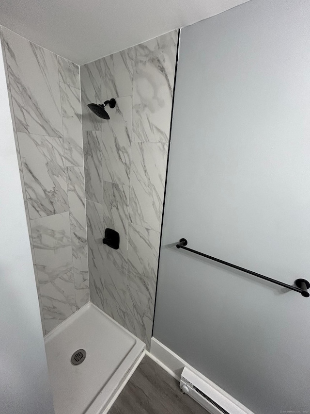 51 Division St, Norwich, CT 06360 - bathroom featuring a tile shower and baseboard heating