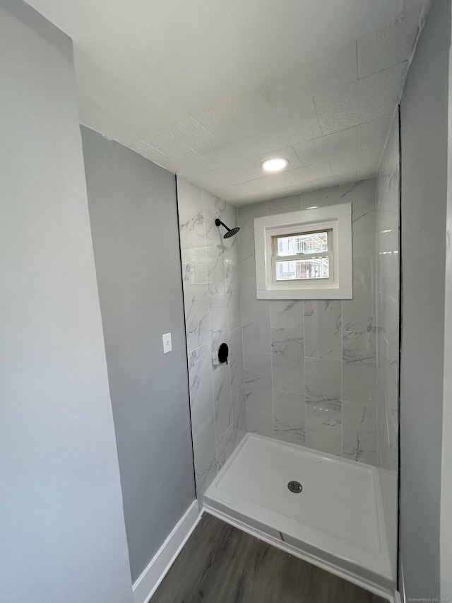 51 Division St, Norwich, CT 06360 - bathroom with tiled shower and wood finished floors