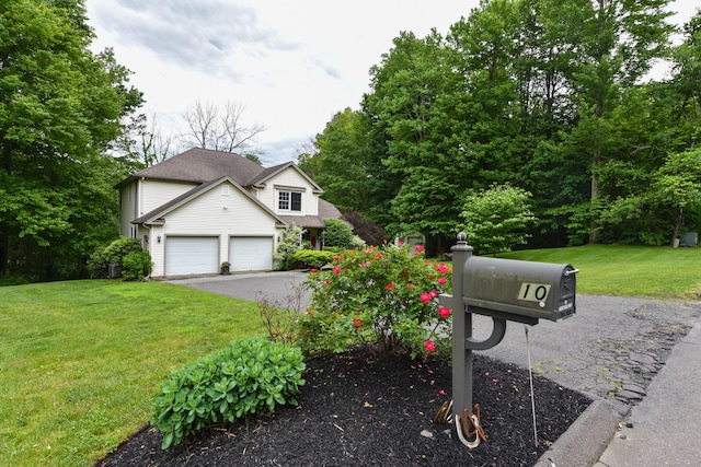 10 Heritage Way, Barkhamsted, CT 06063 - view of front facade with a garage, a front yard, and asphalt driveway
