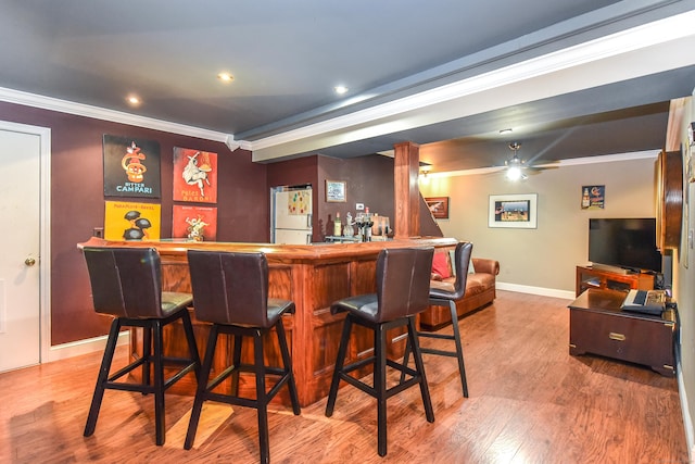 10 Heritage Way, Barkhamsted, CT 06063 - indoor bar with crown molding, freestanding refrigerator, wood finished floors, recessed lighting, and ceiling fan