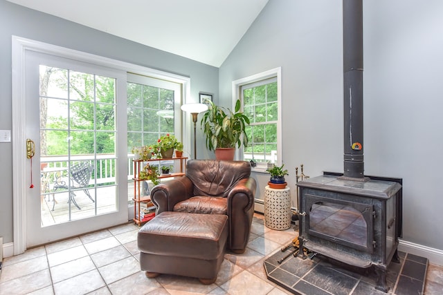 10 Heritage Way, Barkhamsted, CT 06063 - sitting room with a wood stove, vaulted ceiling, and tile patterned floors