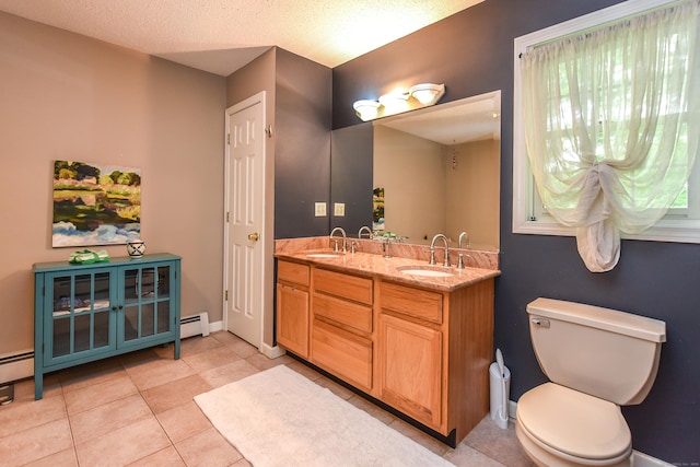 10 Heritage Way, Barkhamsted, CT 06063 - bathroom with a baseboard radiator, double vanity, and tile patterned flooring