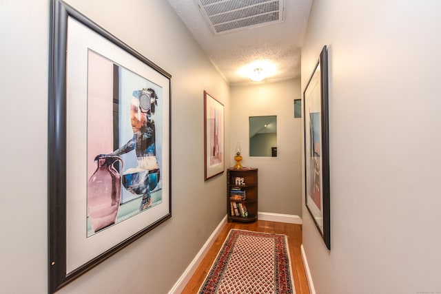 10 Heritage Way, Barkhamsted, CT 06063 - corridor featuring wood finished floors and a textured ceiling