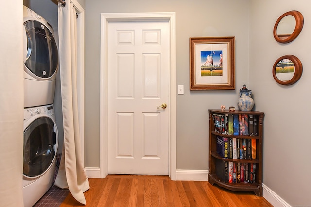 10 Heritage Way, Barkhamsted, CT 06063 - laundry room with stacked washer and clothes dryer and wood finished floors