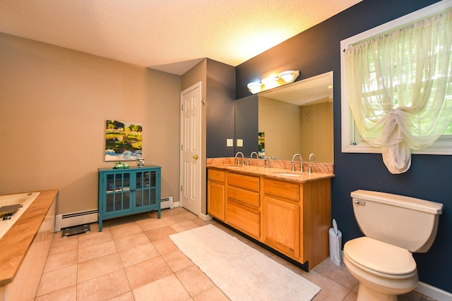 10 Heritage Way, Barkhamsted, CT 06063 - full bath with a baseboard heating unit, double vanity, tile patterned floors, a textured ceiling, and a tub