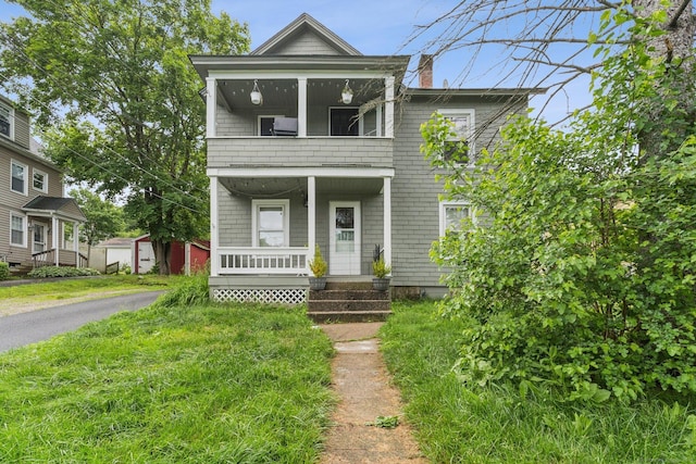 24 Maple St, Torrington, CT 06790 - view of front of house with a balcony, covered porch, and a chimney