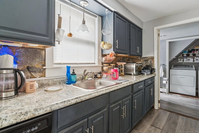 24 Maple St, Torrington, CT 06790 - kitchen with washer / clothes dryer, dishwasher, dark wood-type flooring, light countertops, and decorative backsplash