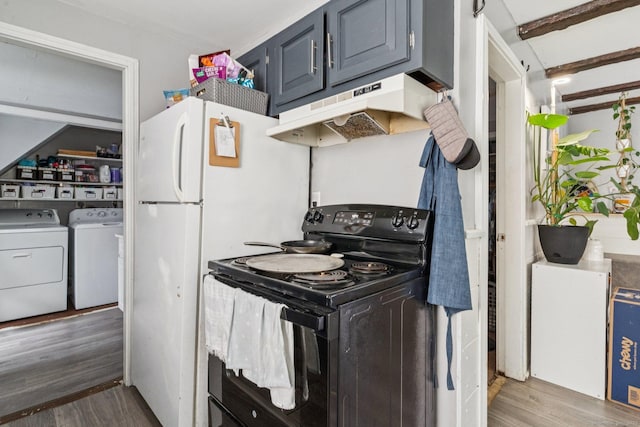 24 Maple St, Torrington, CT 06790 - kitchen with black range with electric stovetop, under cabinet range hood, independent washer and dryer, and wood finished floors