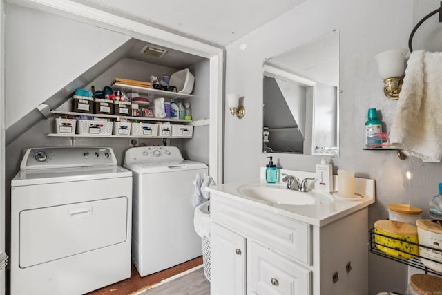 24 Maple St, Torrington, CT 06790 - washroom featuring washing machine and dryer and wood finished floors