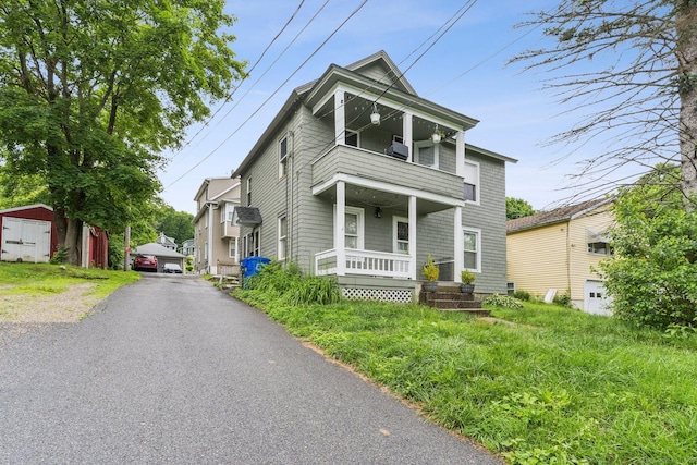 24 Maple St, Torrington, CT 06790 - traditional-style home featuring a balcony, a storage unit, and a porch