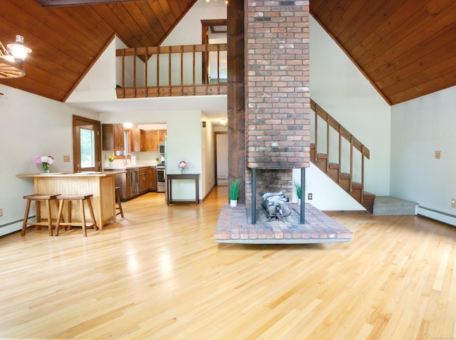 115B Torrington Ave, Canton, CT 06019 - living room featuring high vaulted ceiling, light wood-type flooring, a baseboard heating unit, wooden ceiling, and stairway