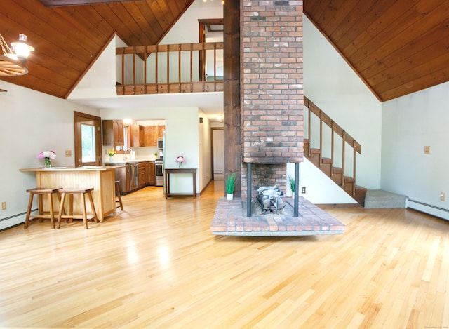 115B Torrington Ave, Canton, CT 06019 - living room with high vaulted ceiling, light wood finished floors, stairs, a baseboard radiator, and wood ceiling