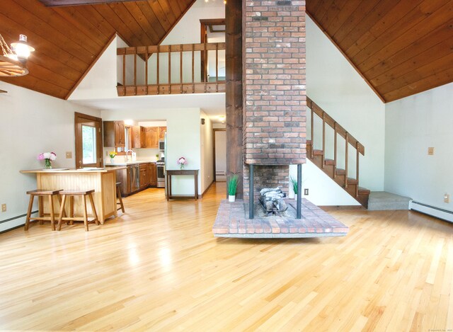 115B Torrington Ave, Canton, CT 06019 - living room with high vaulted ceiling, light wood finished floors, stairs, a baseboard radiator, and wood ceiling
