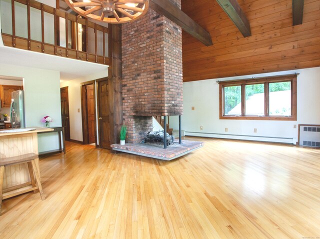 115B Torrington Ave, Canton, CT 06019 - unfurnished living room with a baseboard radiator, high vaulted ceiling, a fireplace, light wood-style floors, and radiator