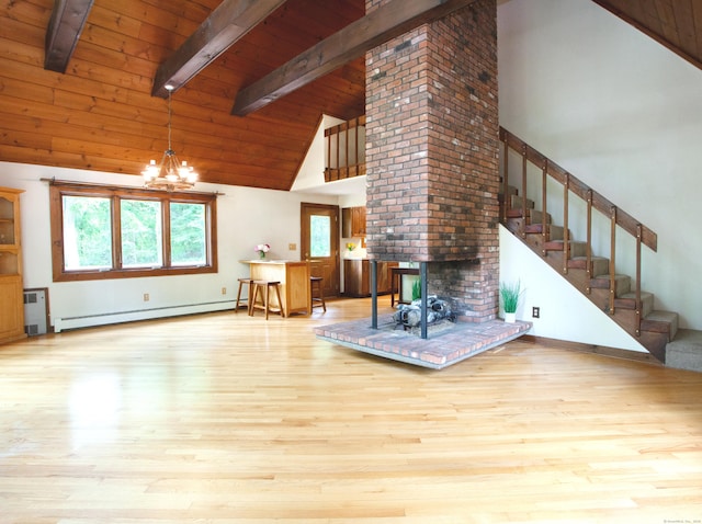115B Torrington Ave, Canton, CT 06019 - living room with high vaulted ceiling, baseboard heating, wooden ceiling with exposed beams, stairs, and wood finished floors