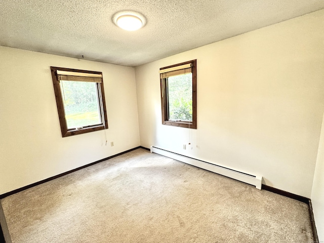 115B Torrington Ave, Canton, CT 06019 - unfurnished room with plenty of natural light, carpet floors, baseboard heating, and a textured ceiling