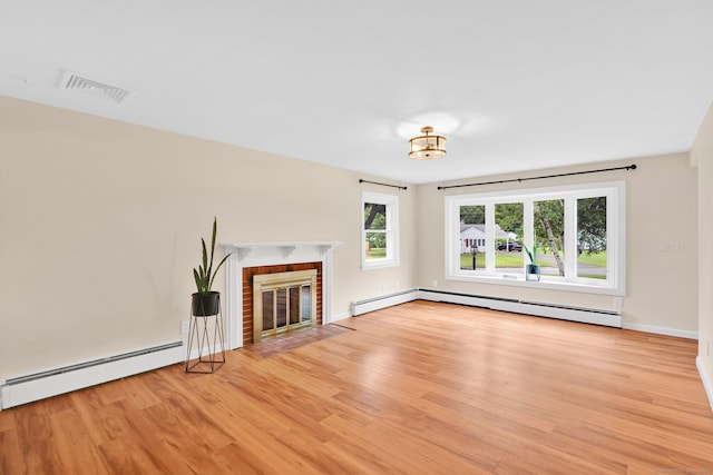 21 Enfield St, Windsor Locks, CT 06096 - unfurnished living room with a baseboard heating unit, light wood-style flooring, a brick fireplace, and baseboards