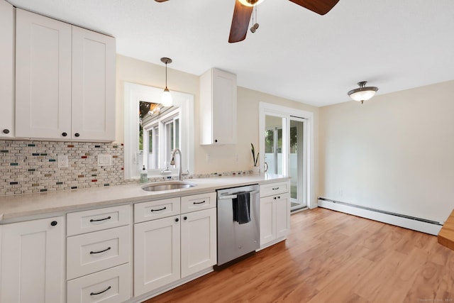 21 Enfield St, Windsor Locks, CT 06096 - kitchen with stainless steel dishwasher, a sink, baseboard heating, a ceiling fan, and white cabinets