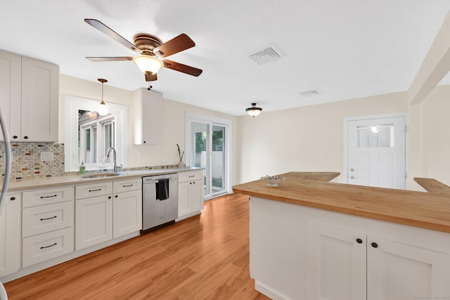 21 Enfield St, Windsor Locks, CT 06096 - kitchen with stainless steel dishwasher, a sink, light wood-type flooring, tasteful backsplash, and ceiling fan