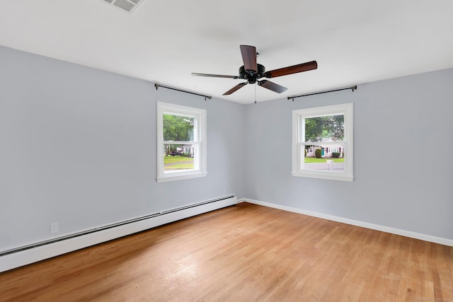 21 Enfield St, Windsor Locks, CT 06096 - empty room featuring a baseboard heating unit, plenty of natural light, light wood-style floors, and a ceiling fan