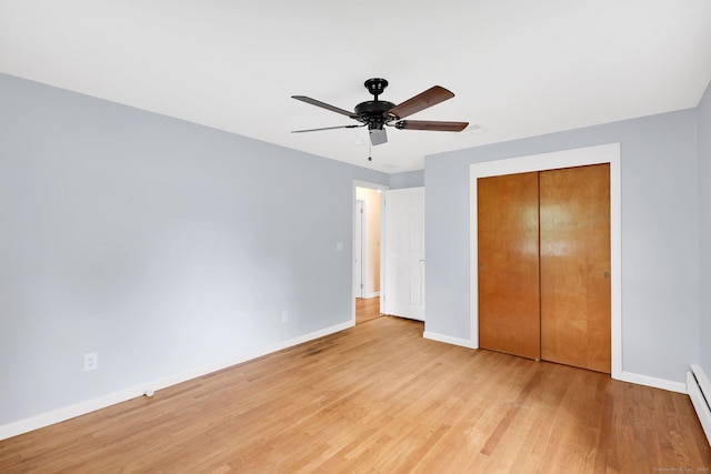 21 Enfield St, Windsor Locks, CT 06096 - unfurnished bedroom featuring baseboard heating, baseboards, and light wood-style floors