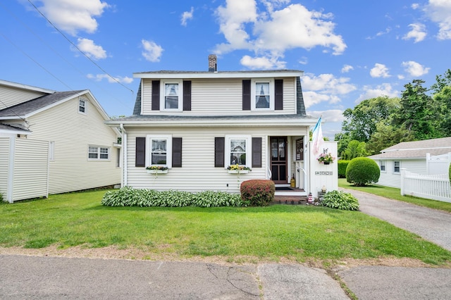 7 Meriden Ave, Westbrook, CT 06498 - view of front of house featuring a chimney, a front yard, and roof with shingles