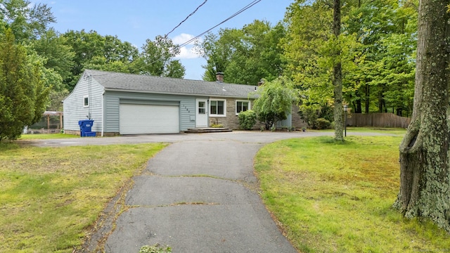 1704 Hill St, Suffield, CT 06078 - ranch-style home featuring asphalt driveway, a garage, and a chimney