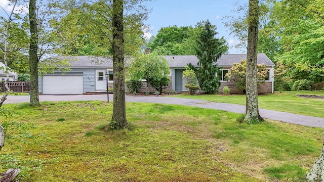1704 Hill St, Suffield, CT 06078 - view of front of property featuring asphalt driveway, a garage, and a front yard