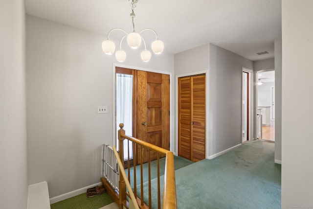 1704 Hill St, Suffield, CT 06078 - hallway with an upstairs landing, carpet, and a chandelier