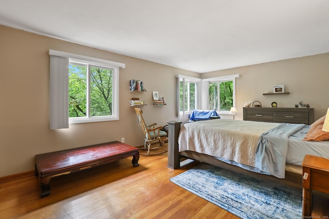 1704 Hill St, Suffield, CT 06078 - bedroom featuring multiple windows and light wood-style floors