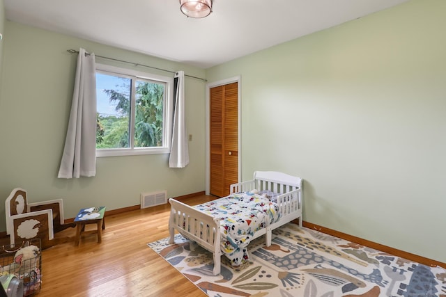 1704 Hill St, Suffield, CT 06078 - bedroom featuring wood finished floors and a closet