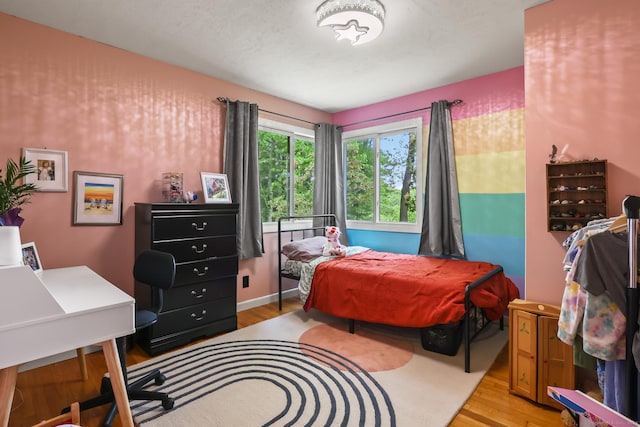1704 Hill St, Suffield, CT 06078 - bedroom with light wood-type flooring and an office area