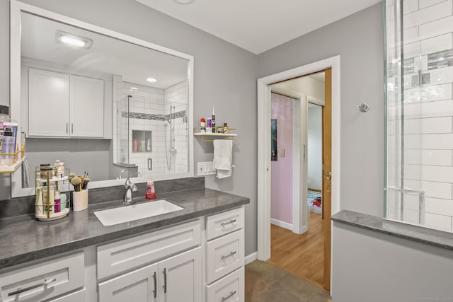 1704 Hill St, Suffield, CT 06078 - kitchen featuring white cabinets, dark countertops, and dark tile patterned floors