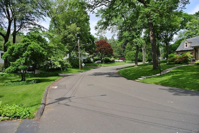 175 Tokeneke Dr, North Haven, CT 06473 - view of asphalt road featuring street lights