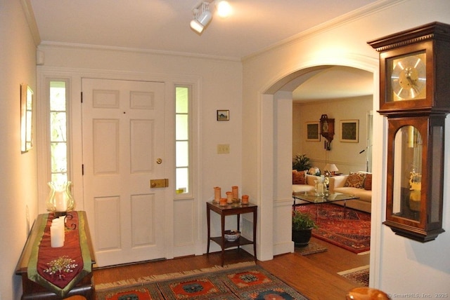 175 Tokeneke Dr, North Haven, CT 06473 - entrance foyer featuring arched walkways, wood finished floors, and ornamental molding