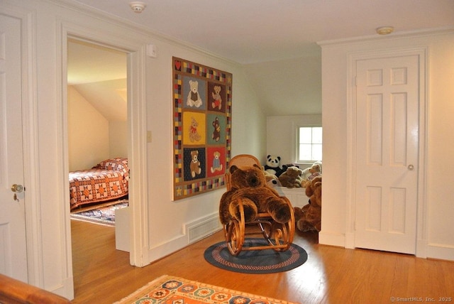 175 Tokeneke Dr, North Haven, CT 06473 - sitting room featuring wood finished floors, lofted ceiling, and crown molding